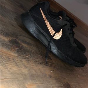 Black and rose gold Nike shoes